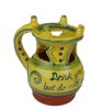 yellow and green puzzle jug