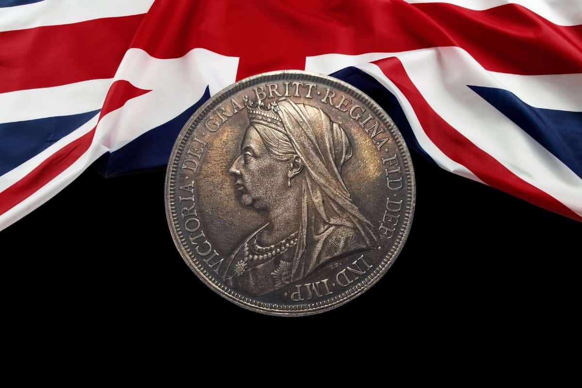 British silver coins a victorian crown and the union flag
