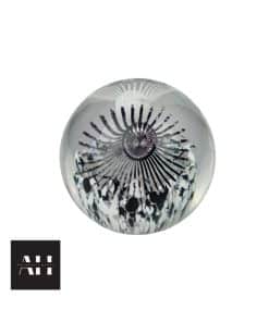 Caithness Luscious Lashes paperweight designed by Helen MacDonald in 2003, spherical glass with bold black and white lash motif, photographed for Antiques & Homes.