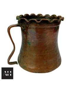 Side view of Antique Copper Tankard, 18th/19th century French copper measure with wavy rim, 13cm high, showing handle and patina.
