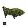 Image of a Trentham Art Pottery Bull money bank with green glaze and turquoise highlights, original label, and Made in England impressed mark.