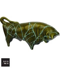 Image of a Trentham Art Pottery Bull money bank with green glaze and turquoise highlights, original label, and Made in England impressed mark.