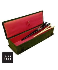 Pair of antique glove stretchers in original velvet box, including ebony with silver hinge and bone set, with decorative cartouche and patina.