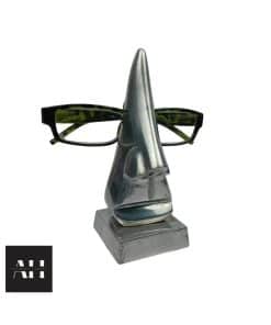 Close-up of Vintage Spectacles Holder in polished aluminium, nose-shaped glasses stand with quirky mid-century design.