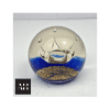 Detail view of Selkirk Glass coronet paperweight with deep blue ground and controlled bubbles