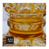 close up pedestal detail on amber vase cut to clear crystal vase