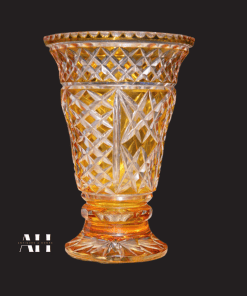 Yellow Amber vase cut to clear crystal pedestal vase with a black background