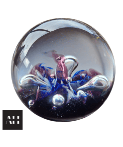 Front view of a Caithness Moonflower Paperweight showing floating floral design inside clear Scottish art glass.