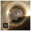 Underside of Victorian Brass Chamberstick base showing aged brass and wear